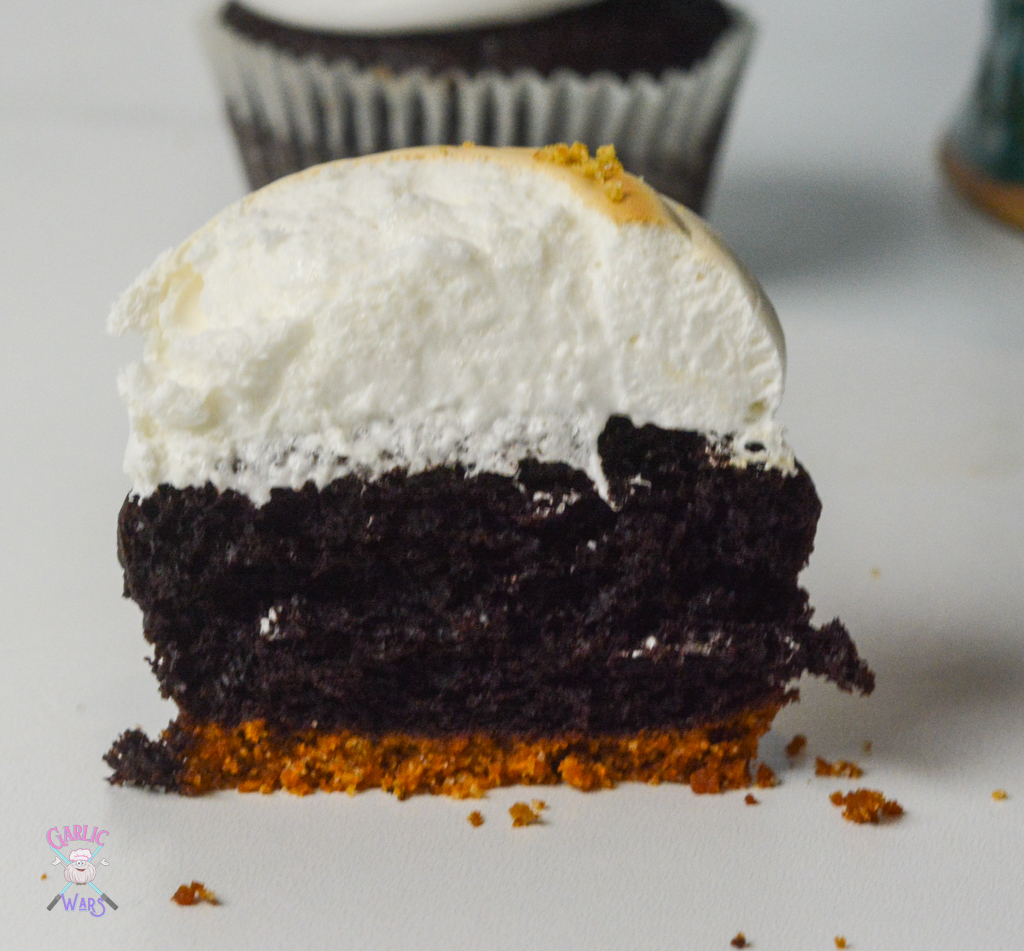 smores cupcake cut open to see pillowy marshmallow frosting