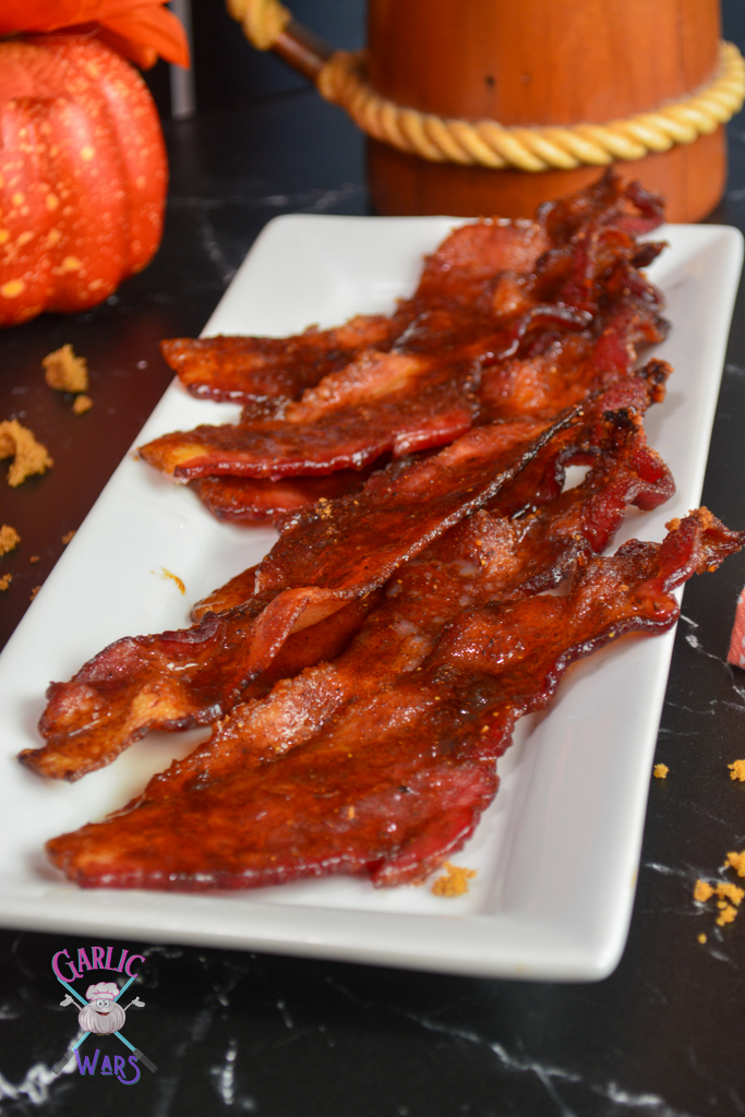 candied bacon on long white plate.