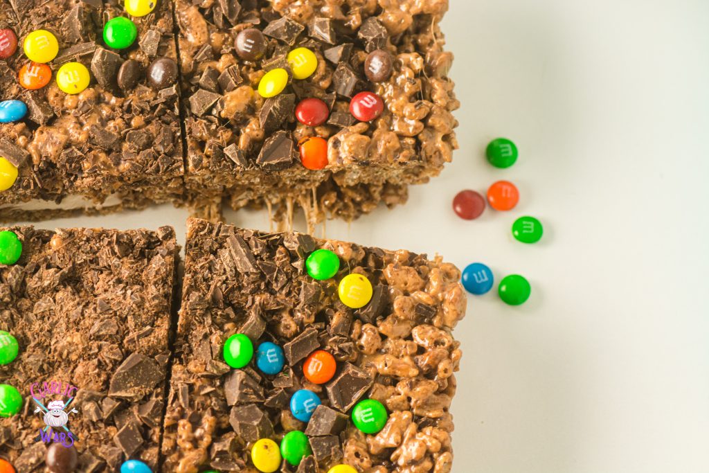 chocolate rice krispie treats with m&ms, pulled apart to see melted marshmallow